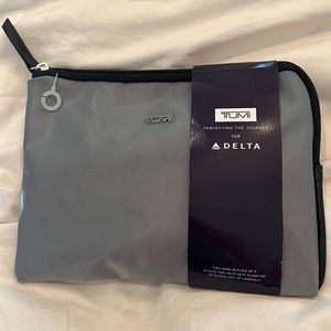- Delta Tumi Bag and travel items